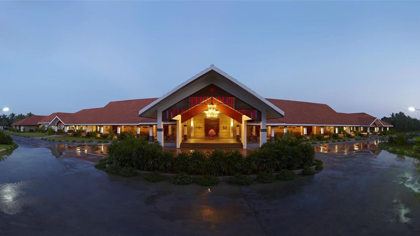 Lobby building and reflecting pool at Radisson Blu Resort Temple Bay, Mamallapuram, at dusk