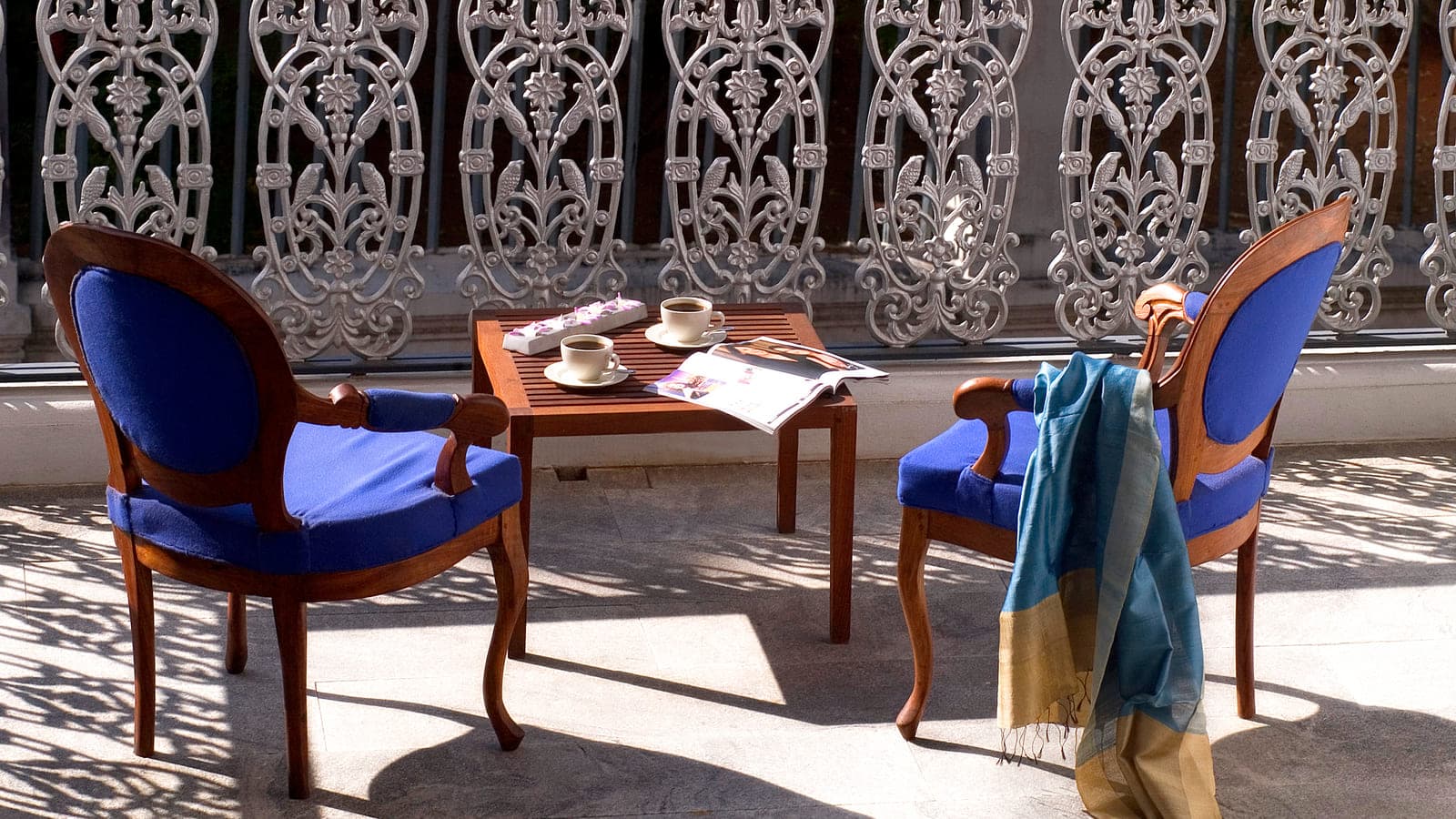 Balcony sitting area with a swing overlooking the garden at Le Dupleix, Pondicherry