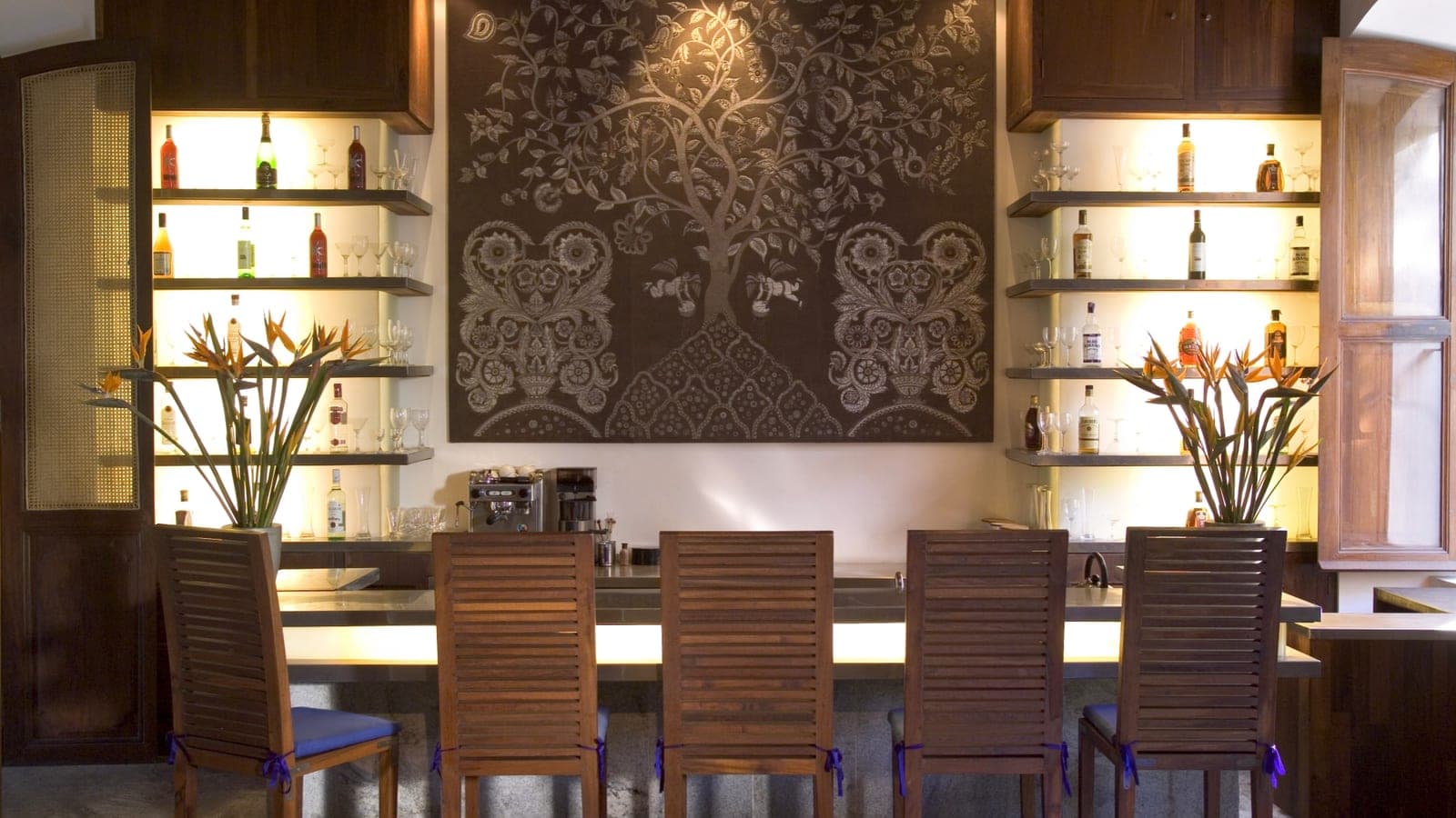 The Governor's Lounge bar with dark-wood shelving at Le Dupleix, Pondicherry