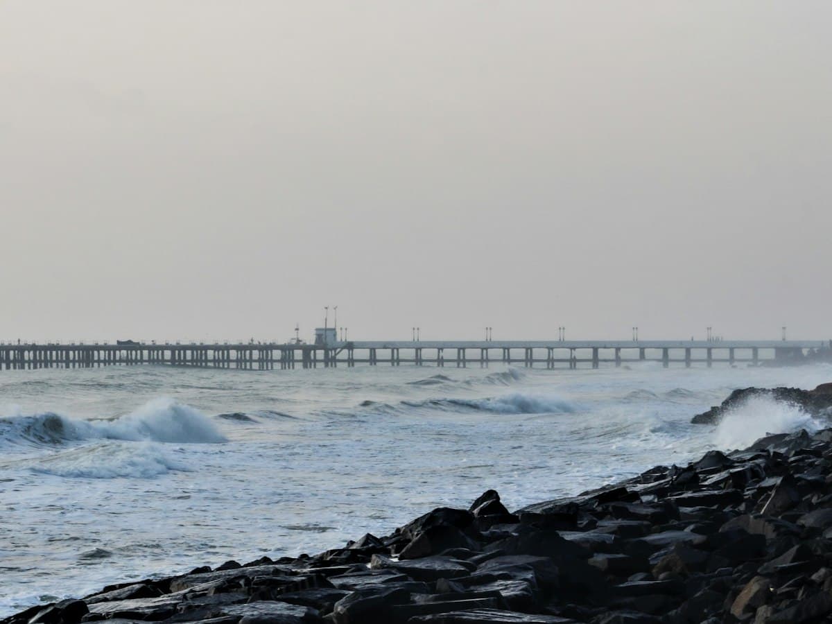 Early-morning light over the seafront Promenade at Rock Beach in Pondicherry.