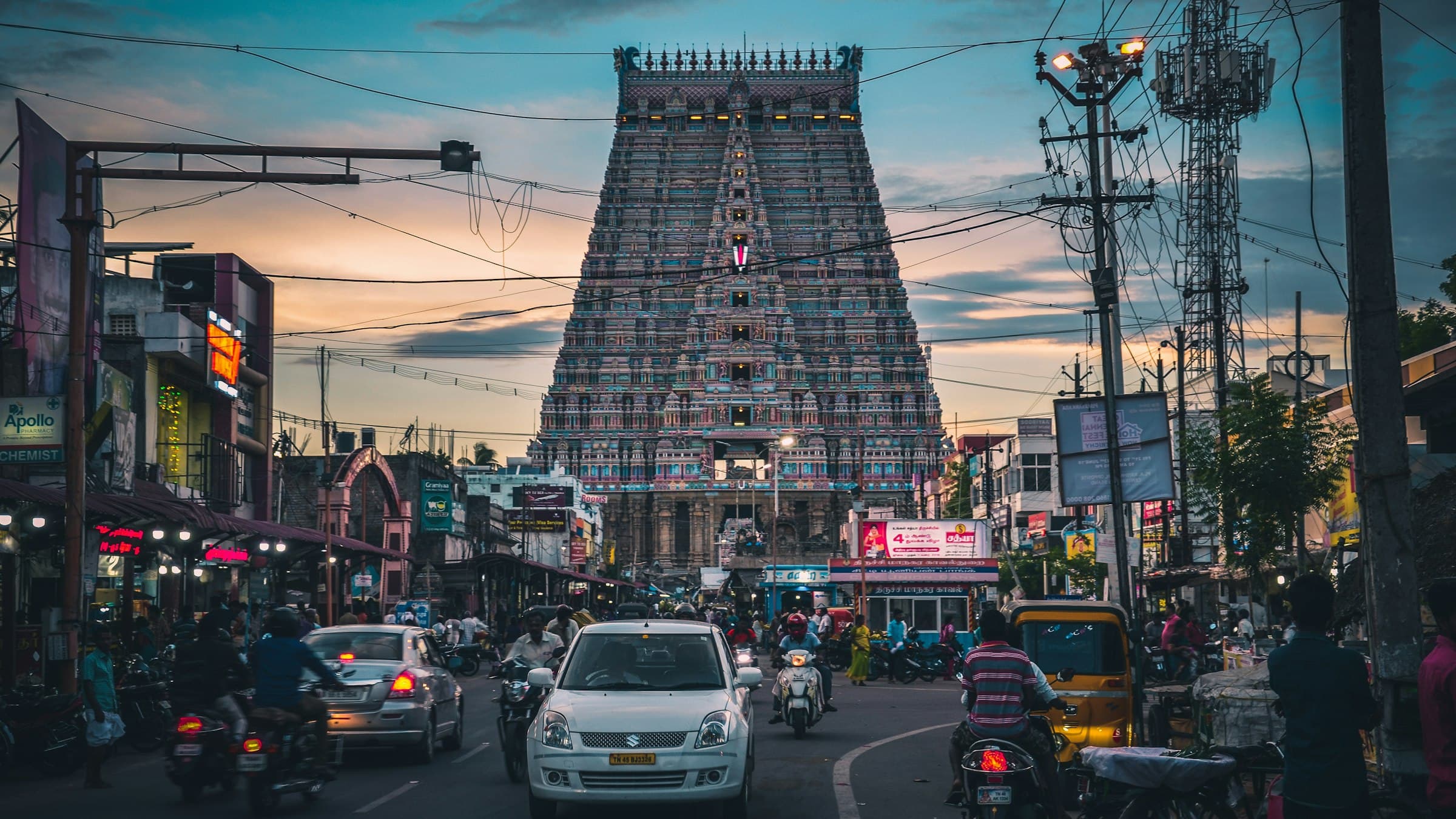 The painted gopuram towers of the Ranganathaswamy temple at Srirangam glow at sunset.