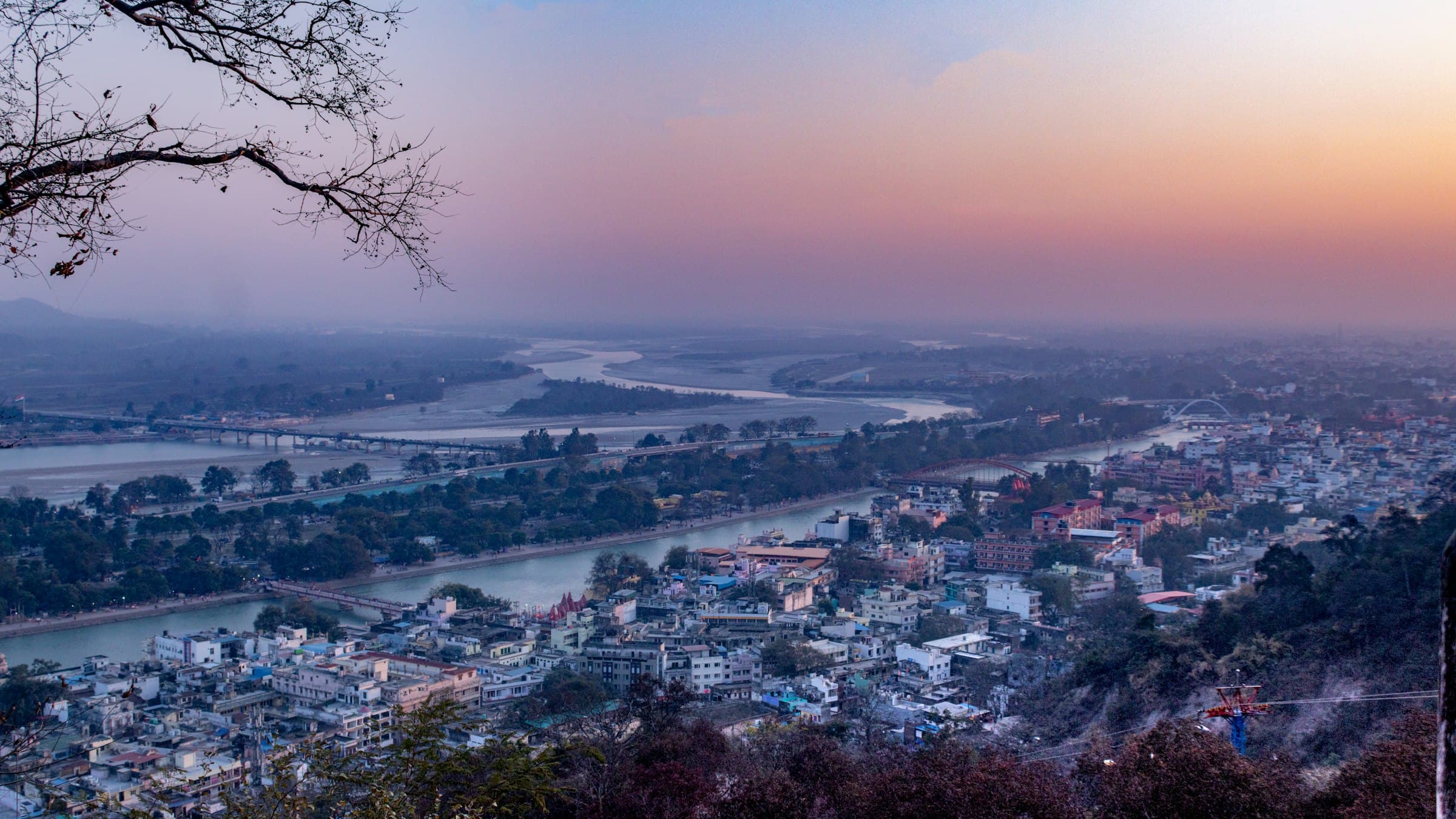Haridwar city and the Ganga river seen from a hillside at dusk, Uttarakhand