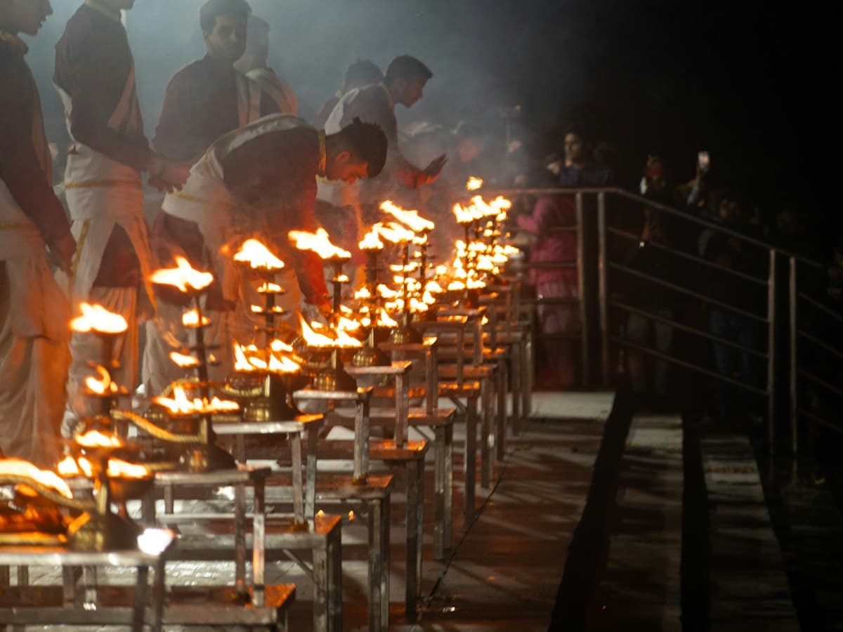 Ganga aarti fire ceremony with lamps at Triveni Ghat on the riverside in Rishikesh