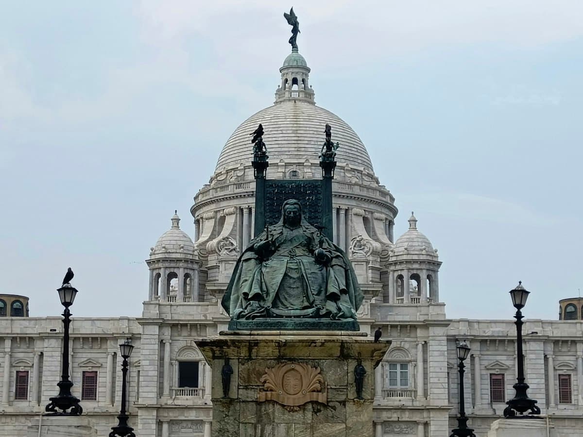 The white marble domed hall of the Victoria Memorial in Kolkata, seen from the gardens