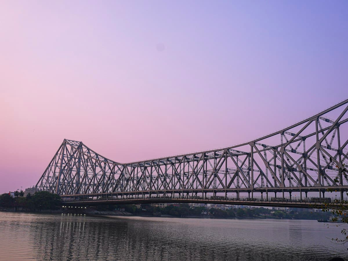 Howrah Bridge cantilever span over the Hooghly River at dusk, Kolkata