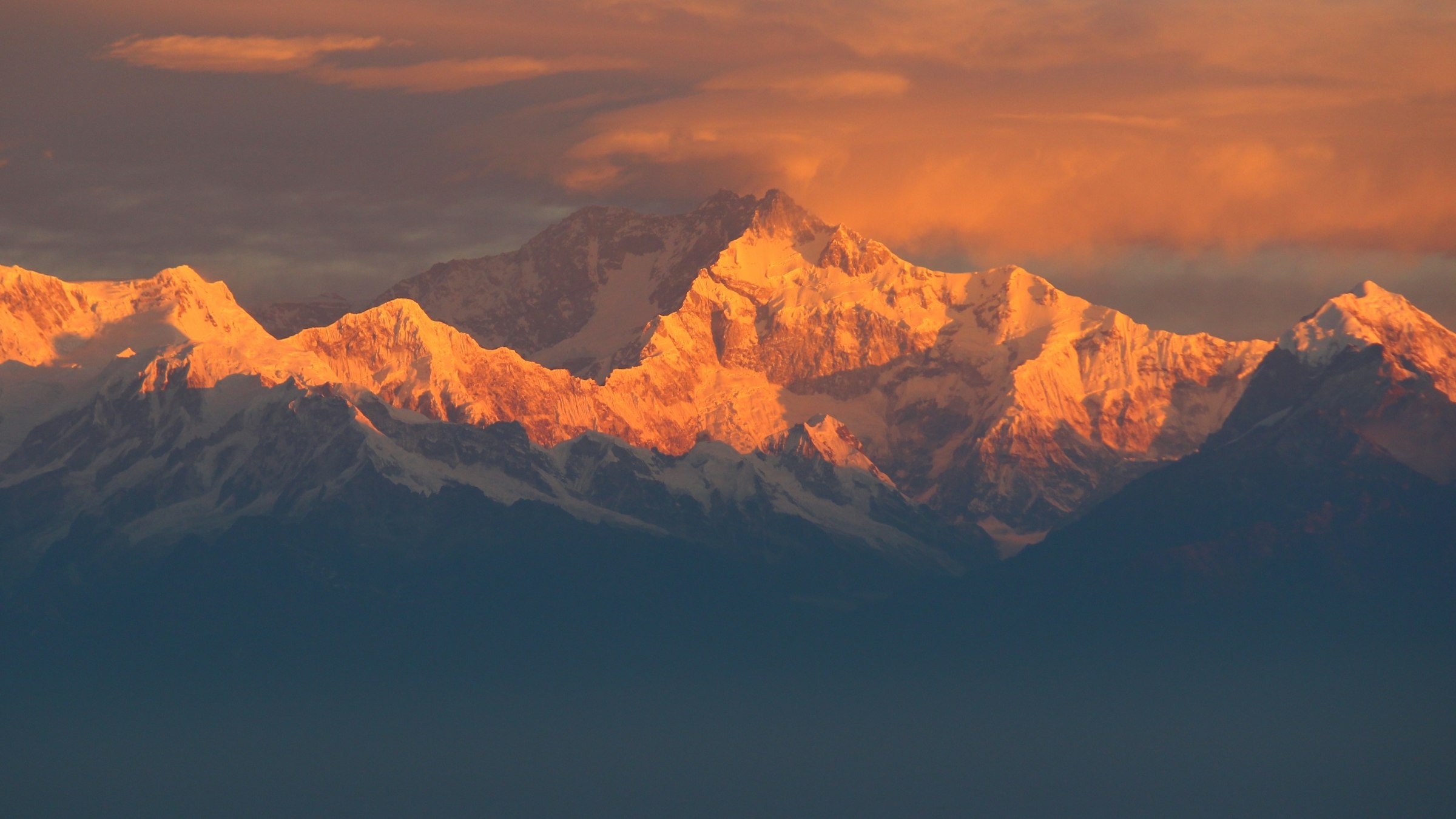 Snow-covered Himalayan peak under daytime sky