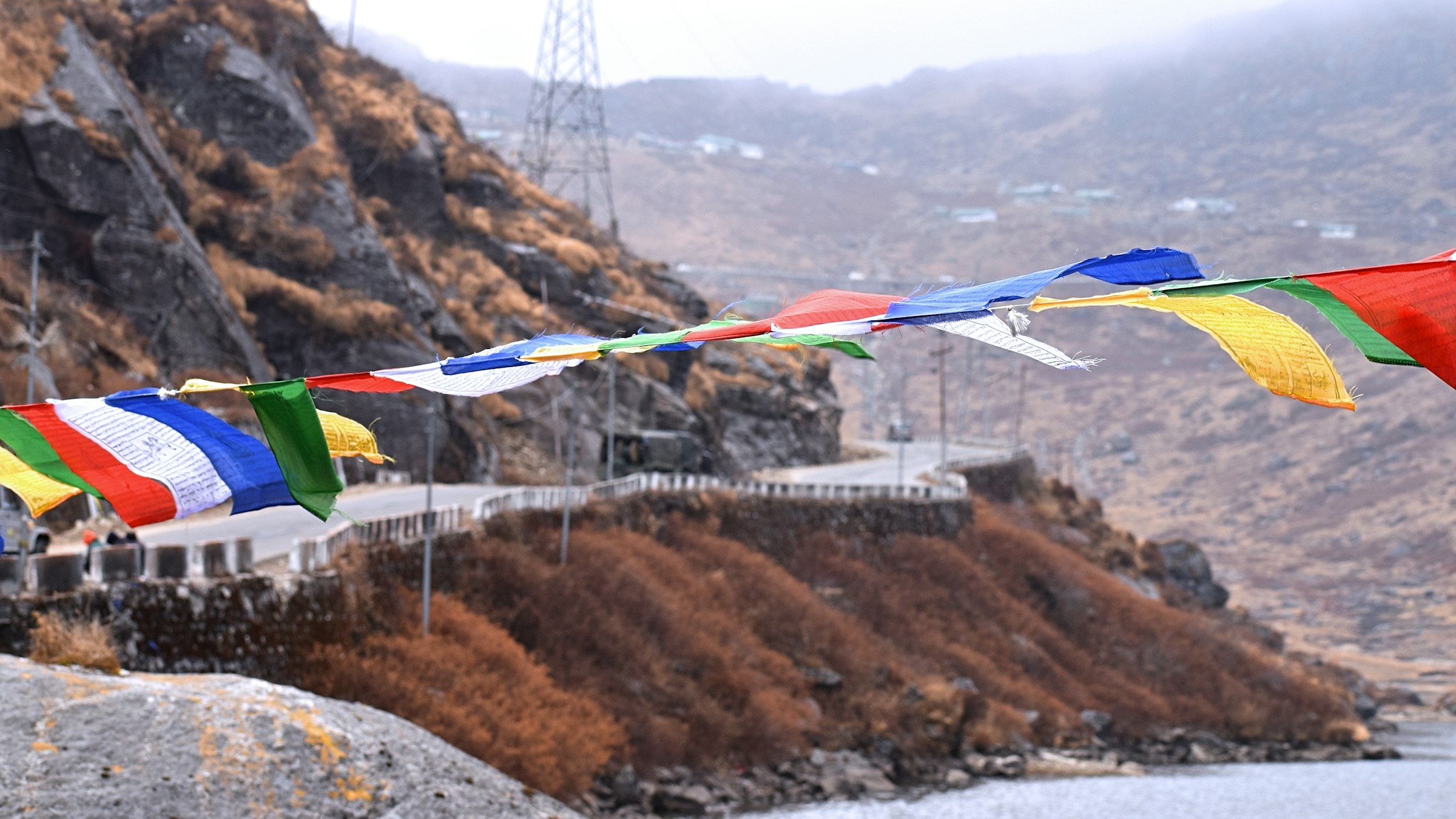 Colorful prayer flags over the water at Tsongo Lake near Gangtok, Sikkim