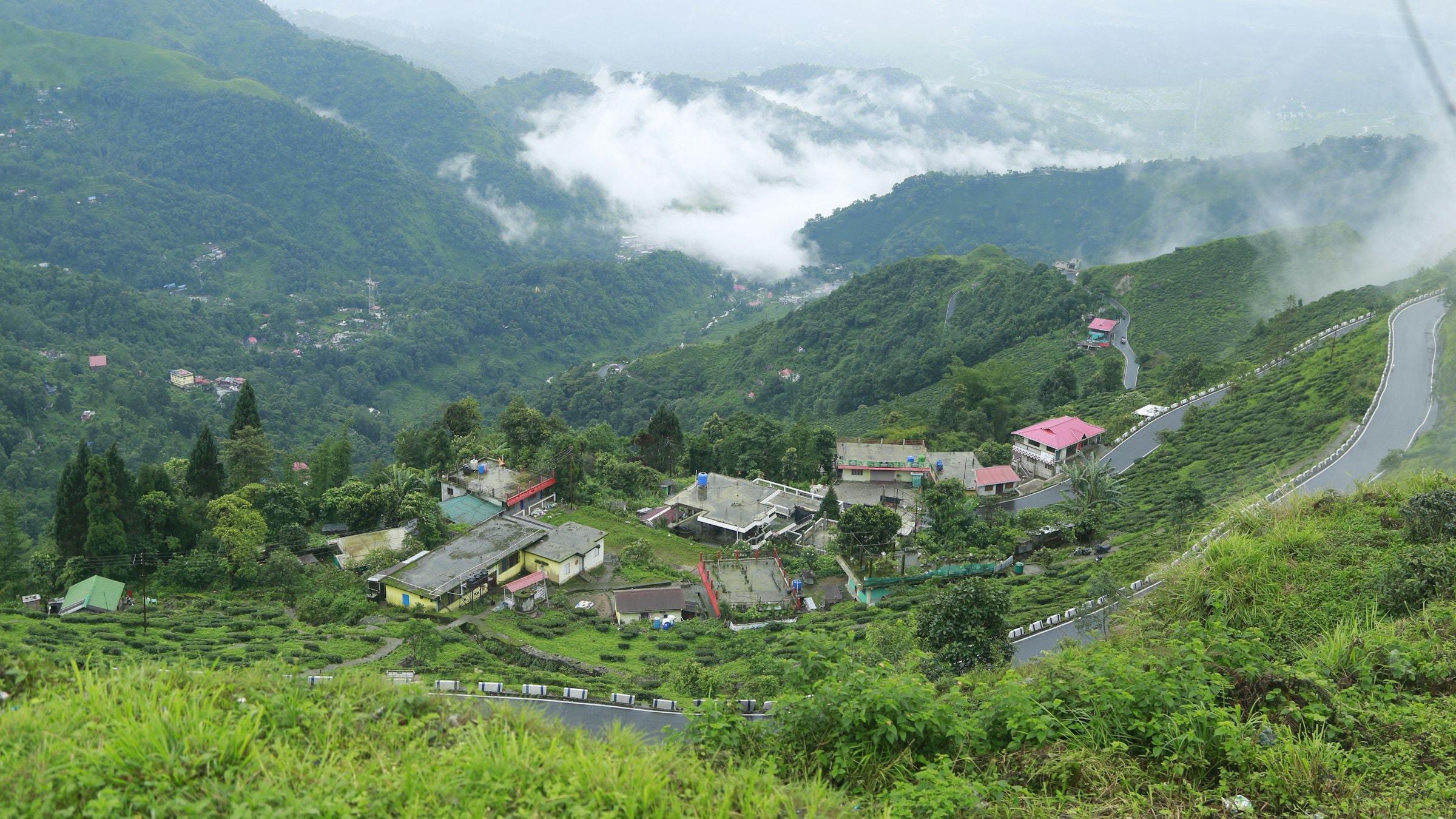 A scenic mountain-top view over Darjeeling's hills and valleys