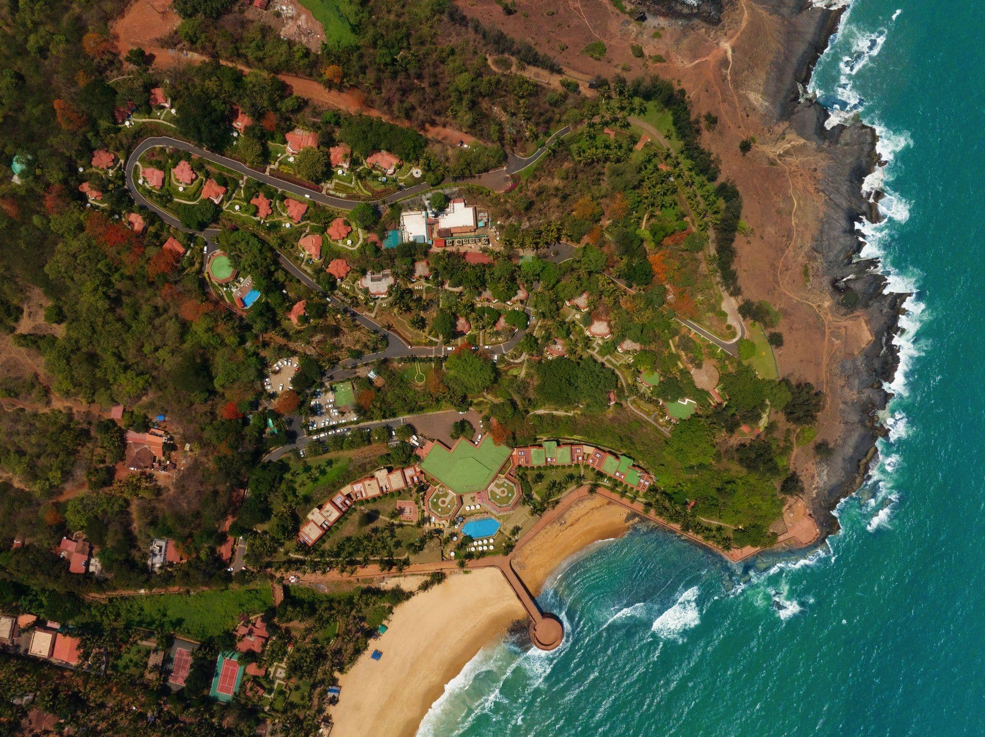 Aerial view of Taj Fort Aguada Resort & Spa on its headland above Sinquerim beach