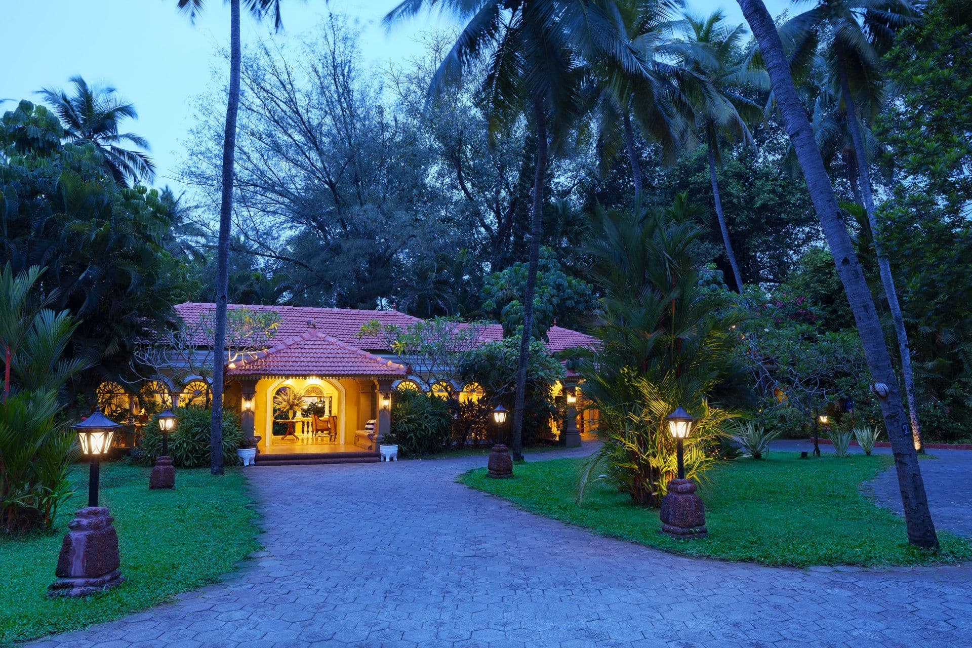 Evening view of the lit Indo-Portuguese entrance at Taj Holiday Village Resort & Spa