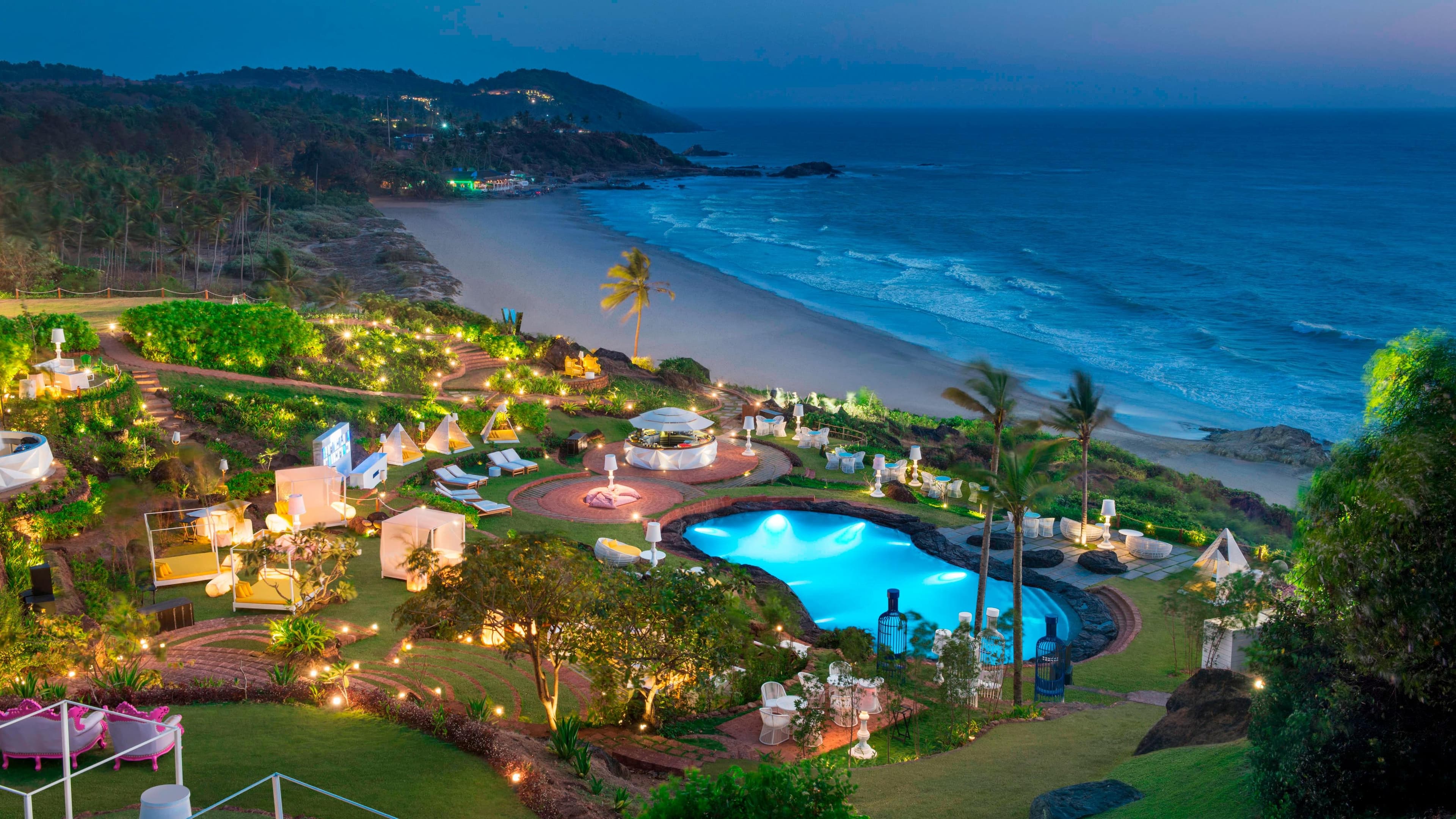 Twilight over the ROCKPOOL and landscaped clifftop grounds of W Goa, Vagator