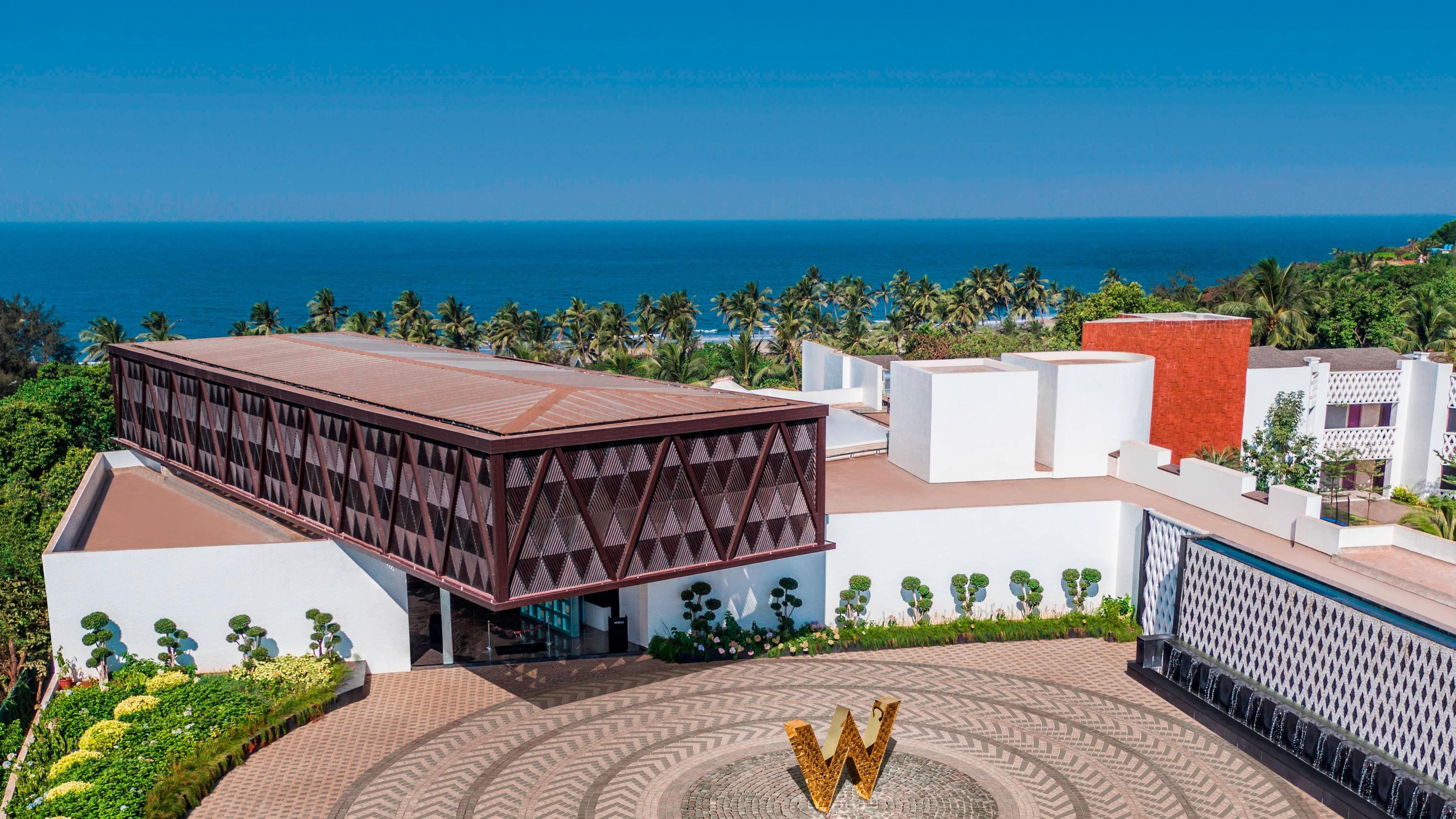 Architectural entrance and W logo at the arrival forecourt of W Goa, Vagator