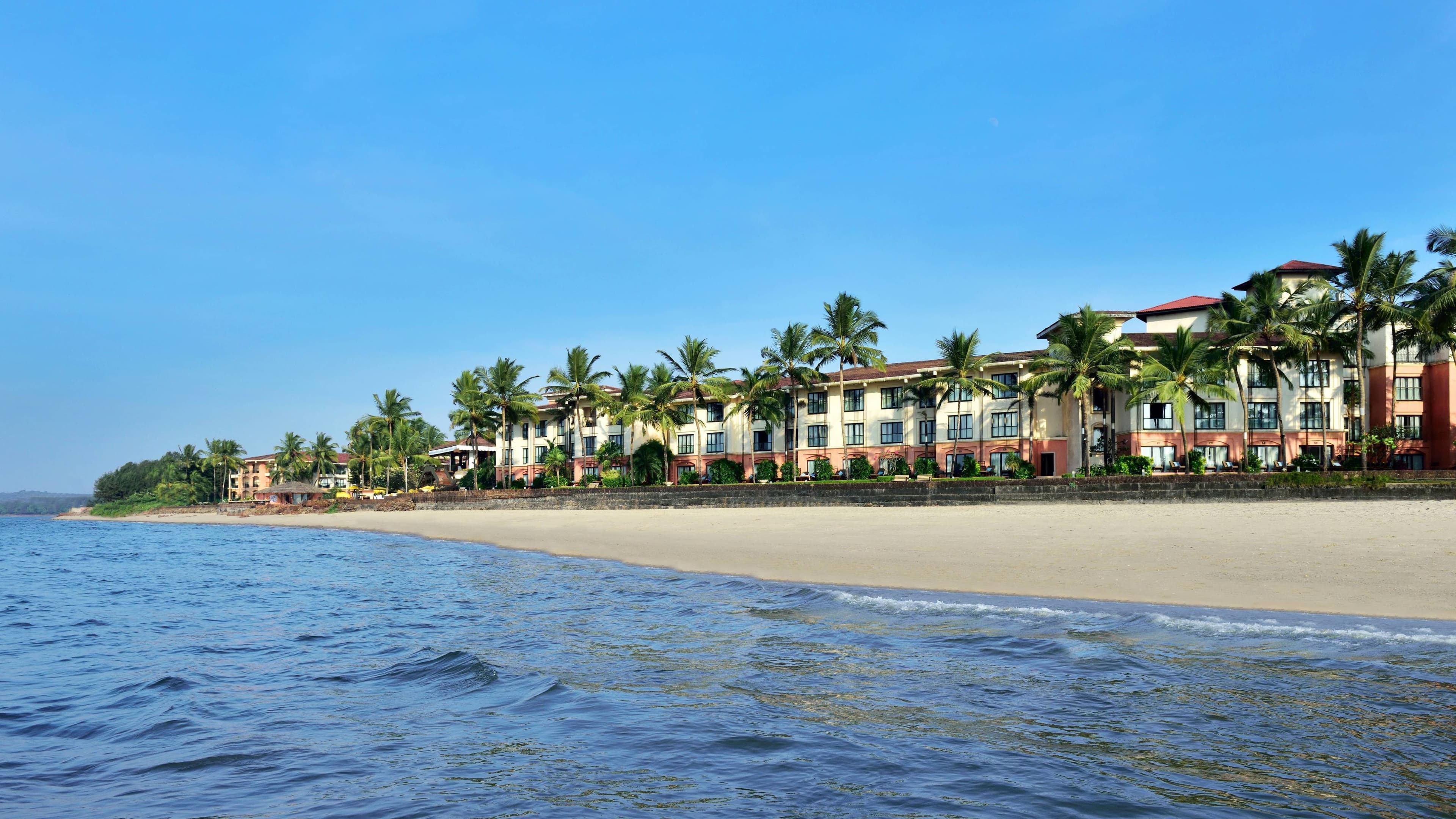 Goa Marriott Resort & Spa along Miramar Beach with palms and the Mandovi estuary