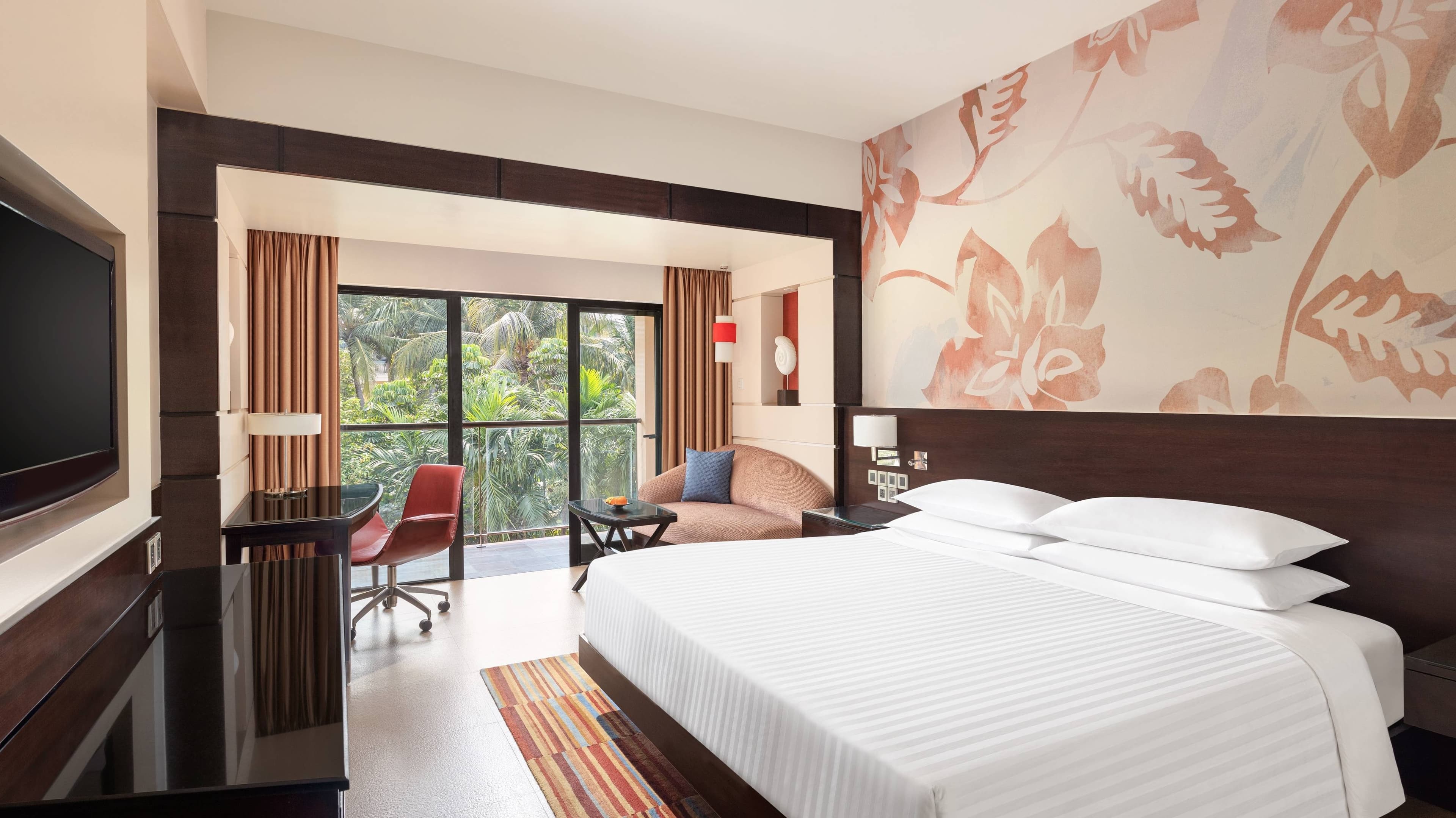 King guest room with garden-view balcony at Goa Marriott Resort & Spa, Panaji