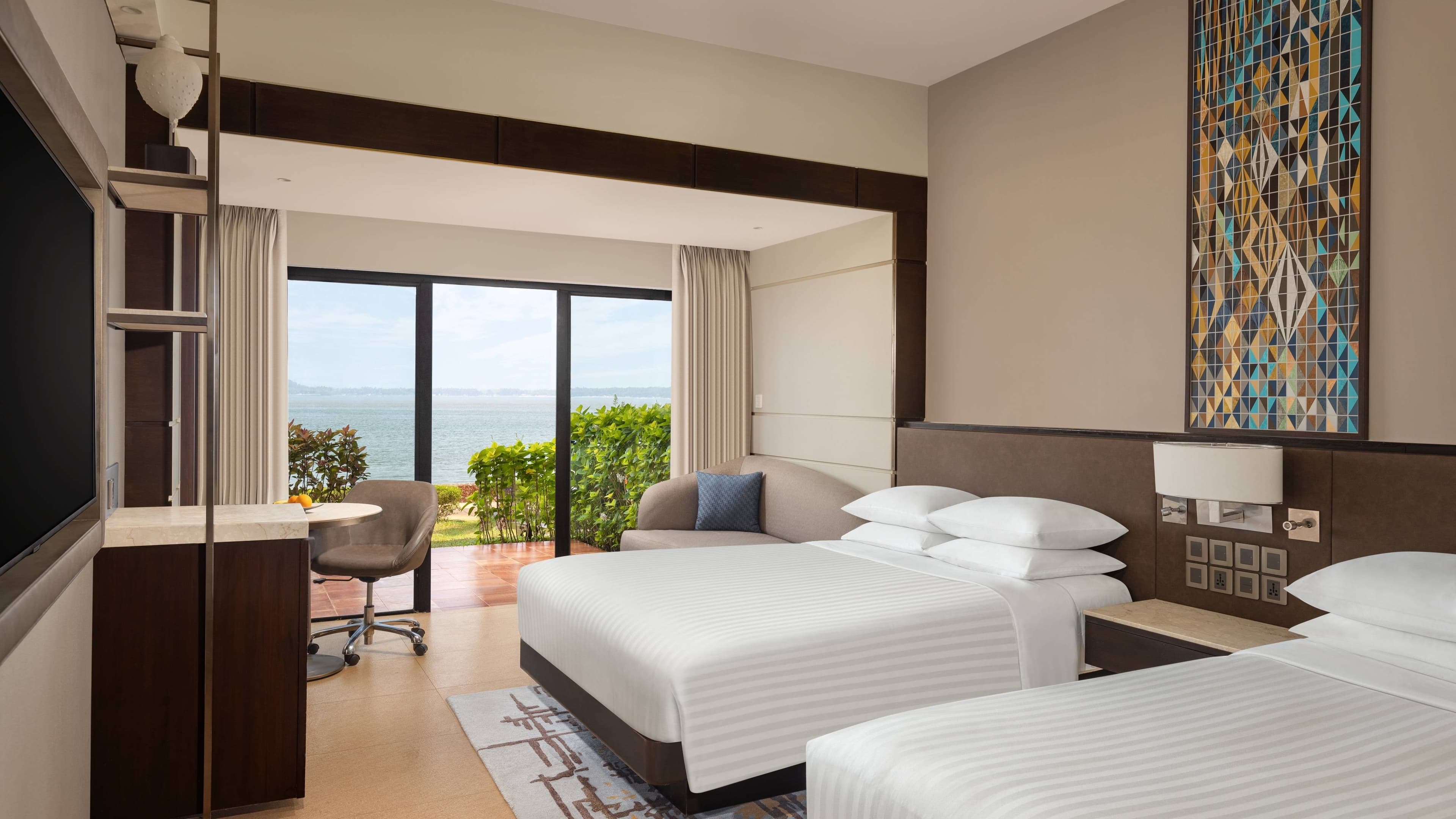 Queen/queen guest room with bay-view balcony at Goa Marriott Resort & Spa