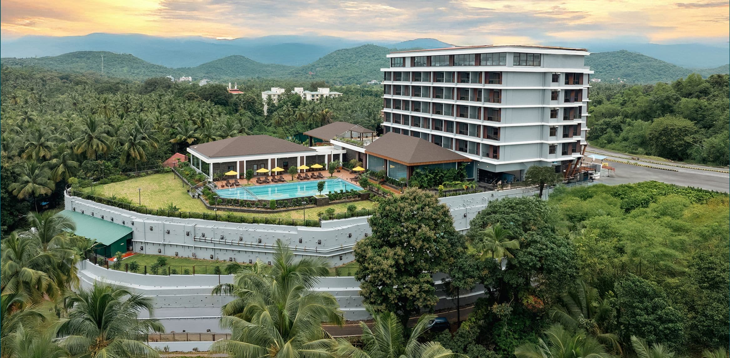 Aerial view of Gateway Goa, Palolem, its pool and the surrounding Canacona hills