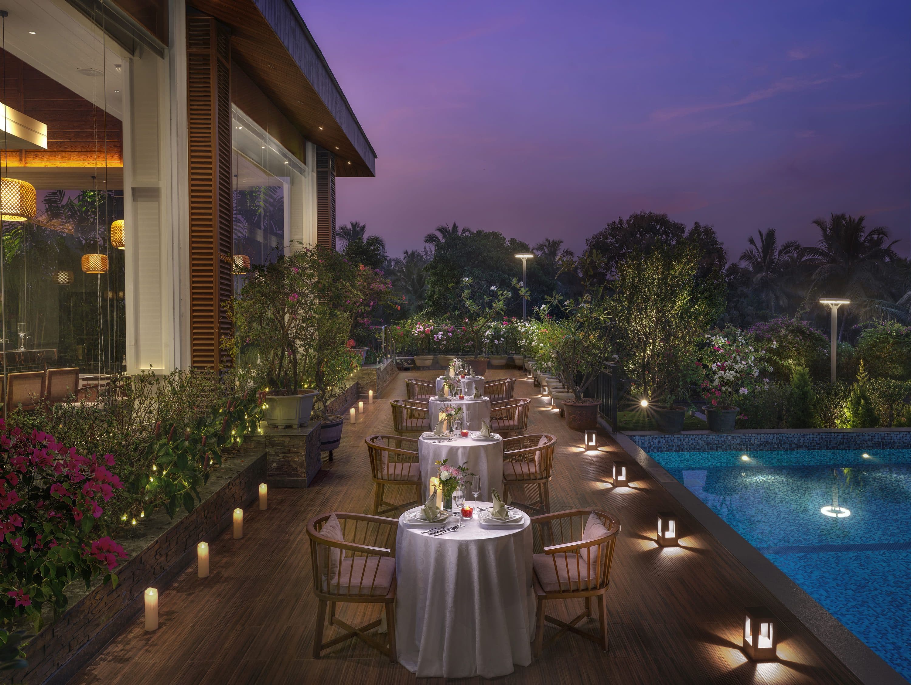 Poolside terrace dining at night at Gateway Goa, Palolem