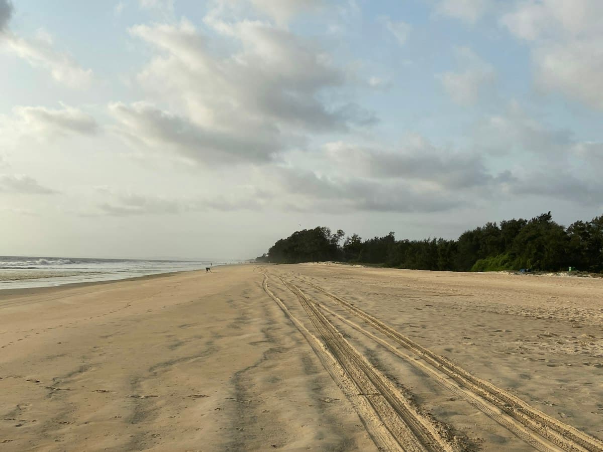 Sandy shore and sea at Varca beach, South Goa