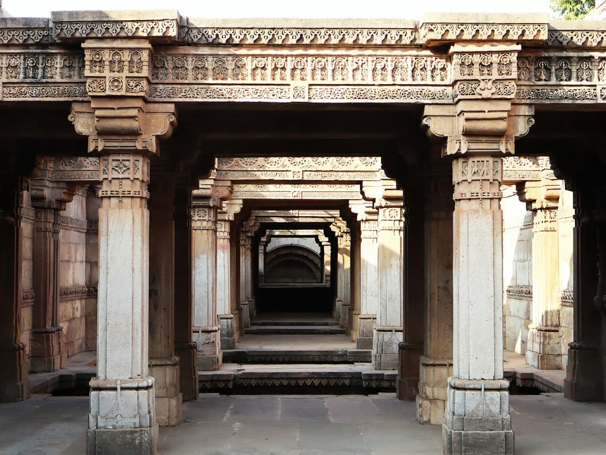 Receding carved stone pillars and galleries inside Adalaj Stepwell (Rudabai Vav), near Ahmedabad, Gujarat