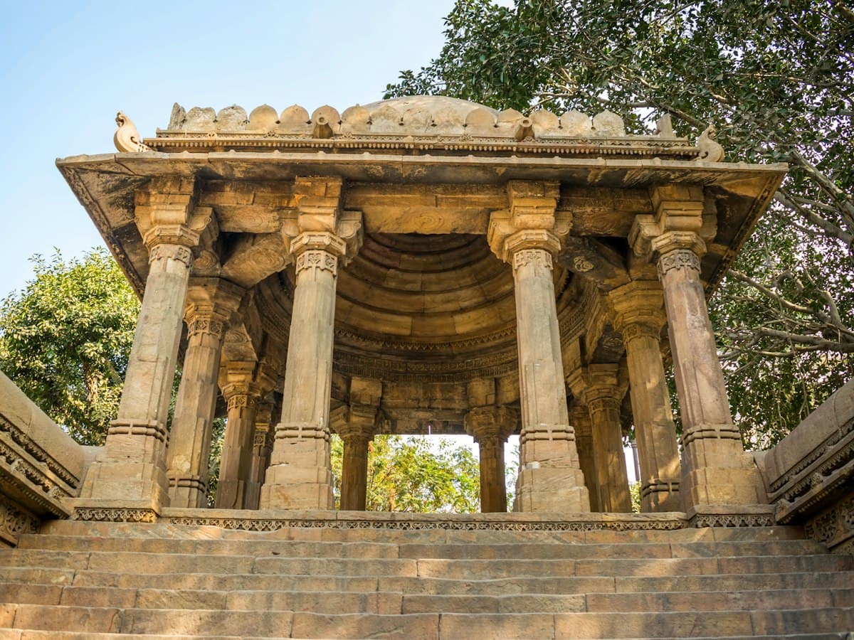 Carved stone pavilion at the entrance of Dada Harir Stepwell in Ahmedabad, Gujarat.