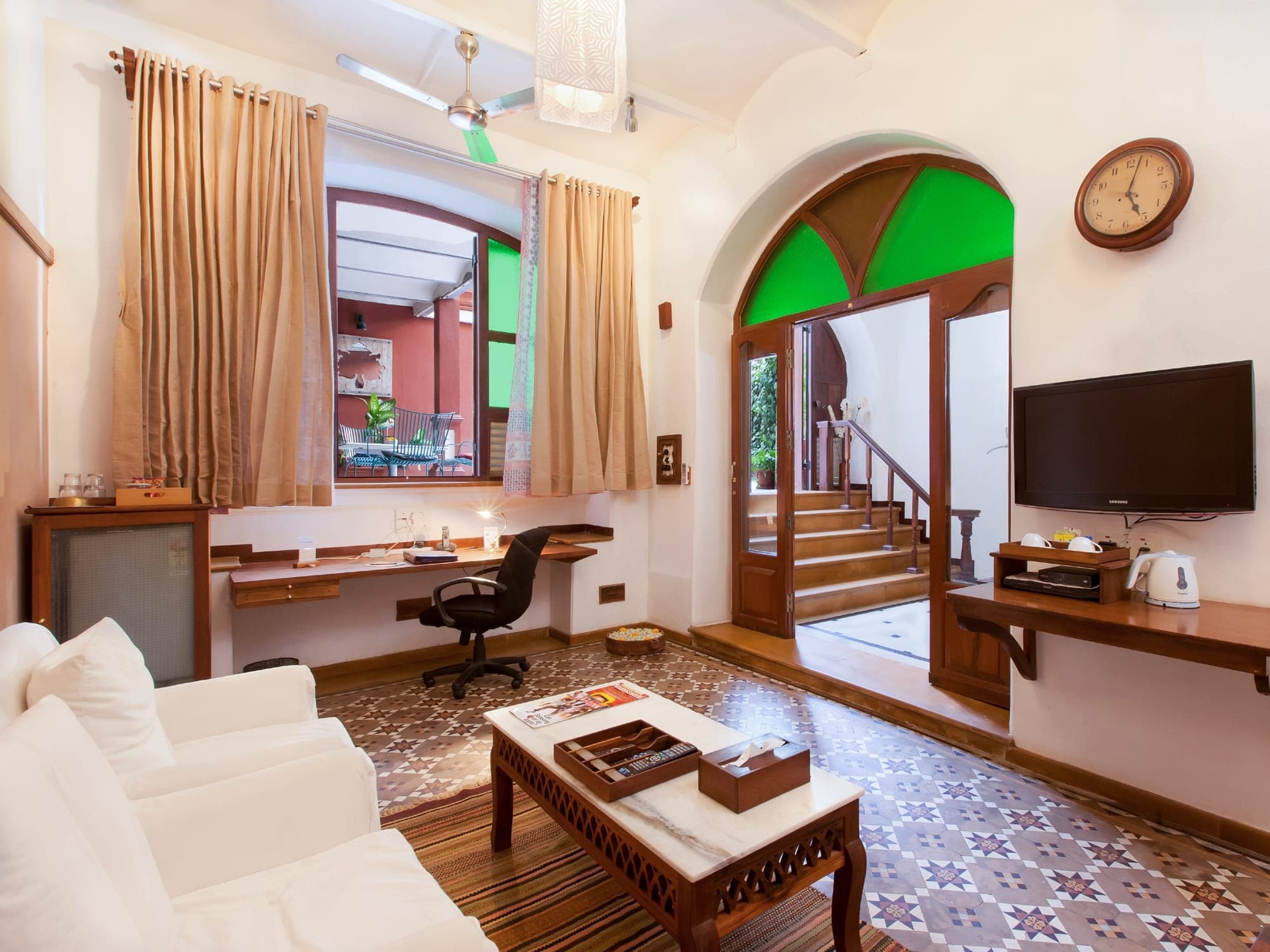 Classic room with work desk and heritage arched window at The House of MG