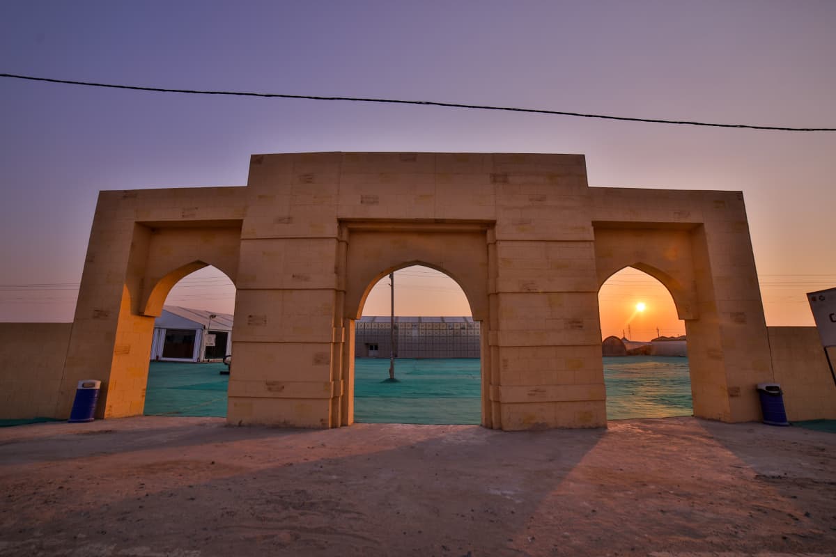 Sandstone arches at Rann Utsav Tent City, Dhordo, framing the Kutch sunset