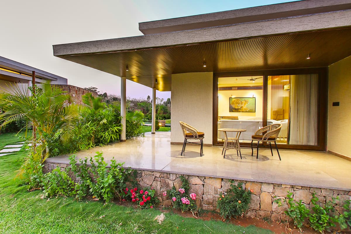 Lake Villa terrace with garden seating at Araiya Gir, Sasan Gir