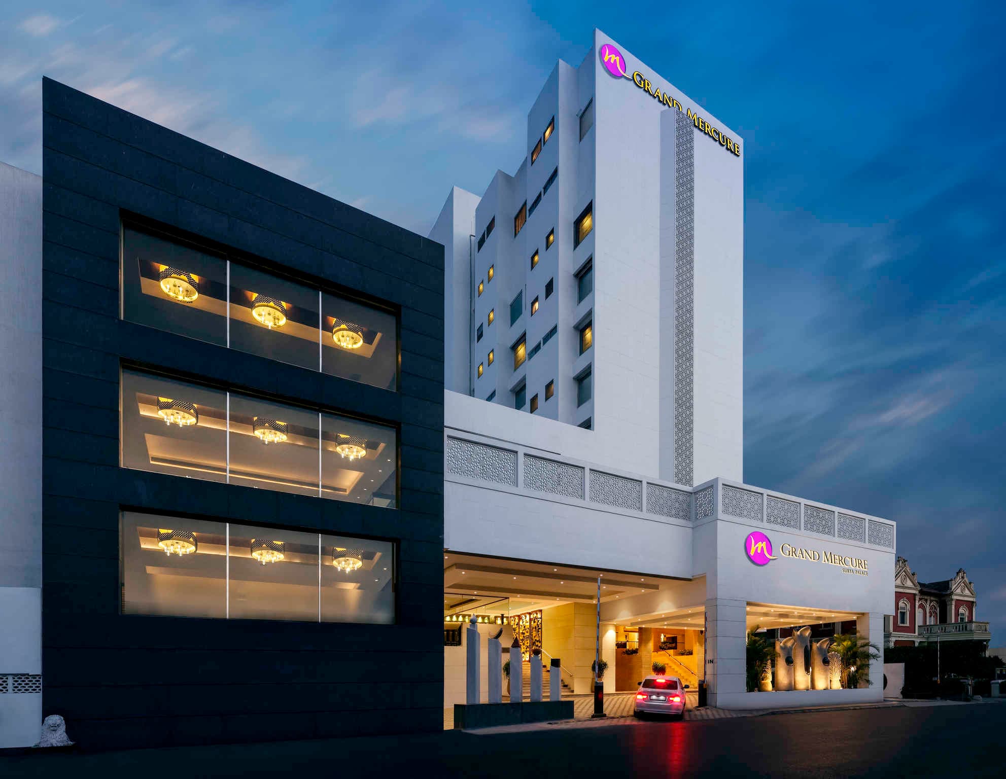 Evening facade of Grand Mercure Vadodara Surya Palace in Sayajigunj