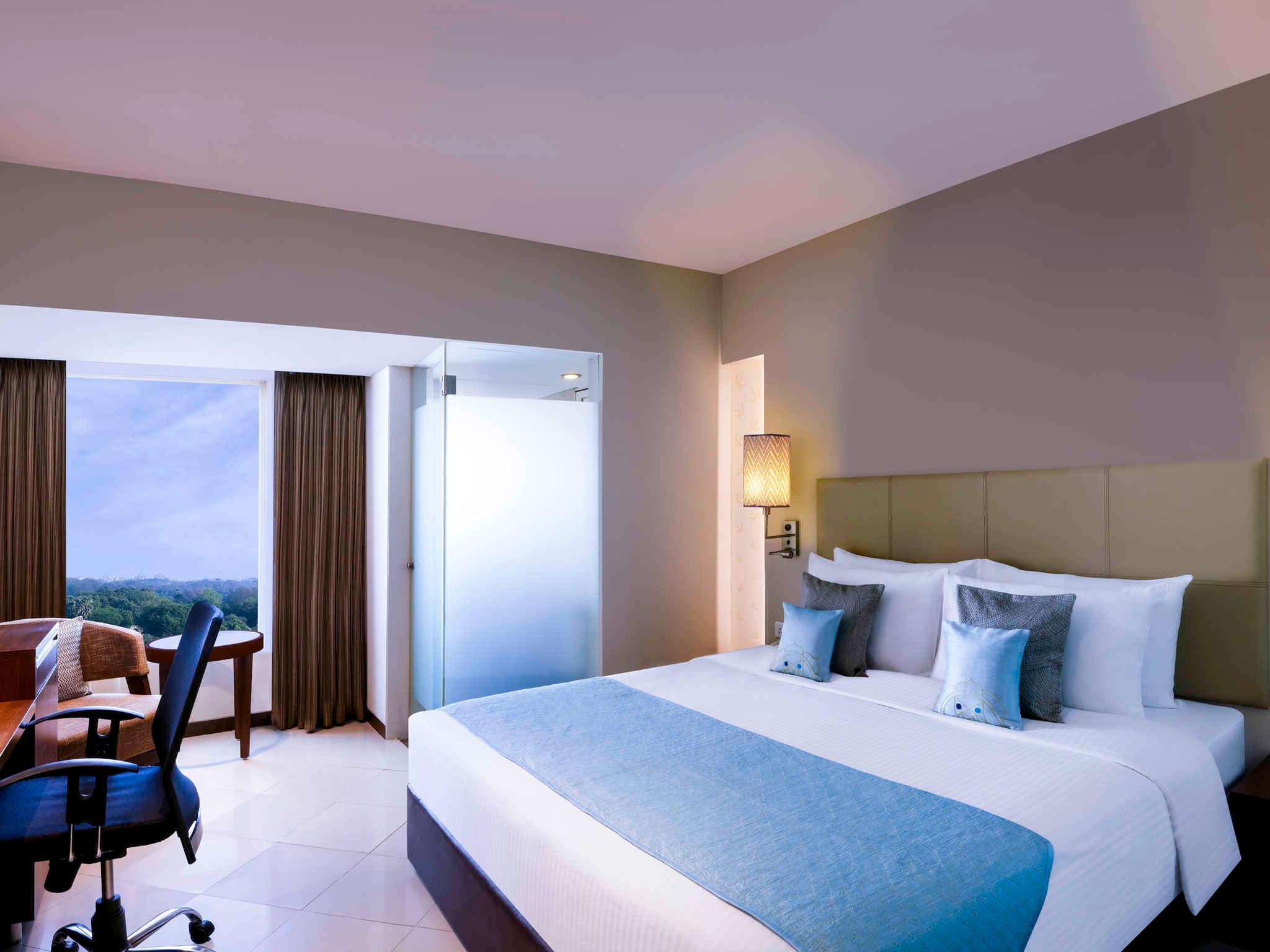 Deluxe Room with king bed and city view at Grand Mercure Vadodara Surya Palace