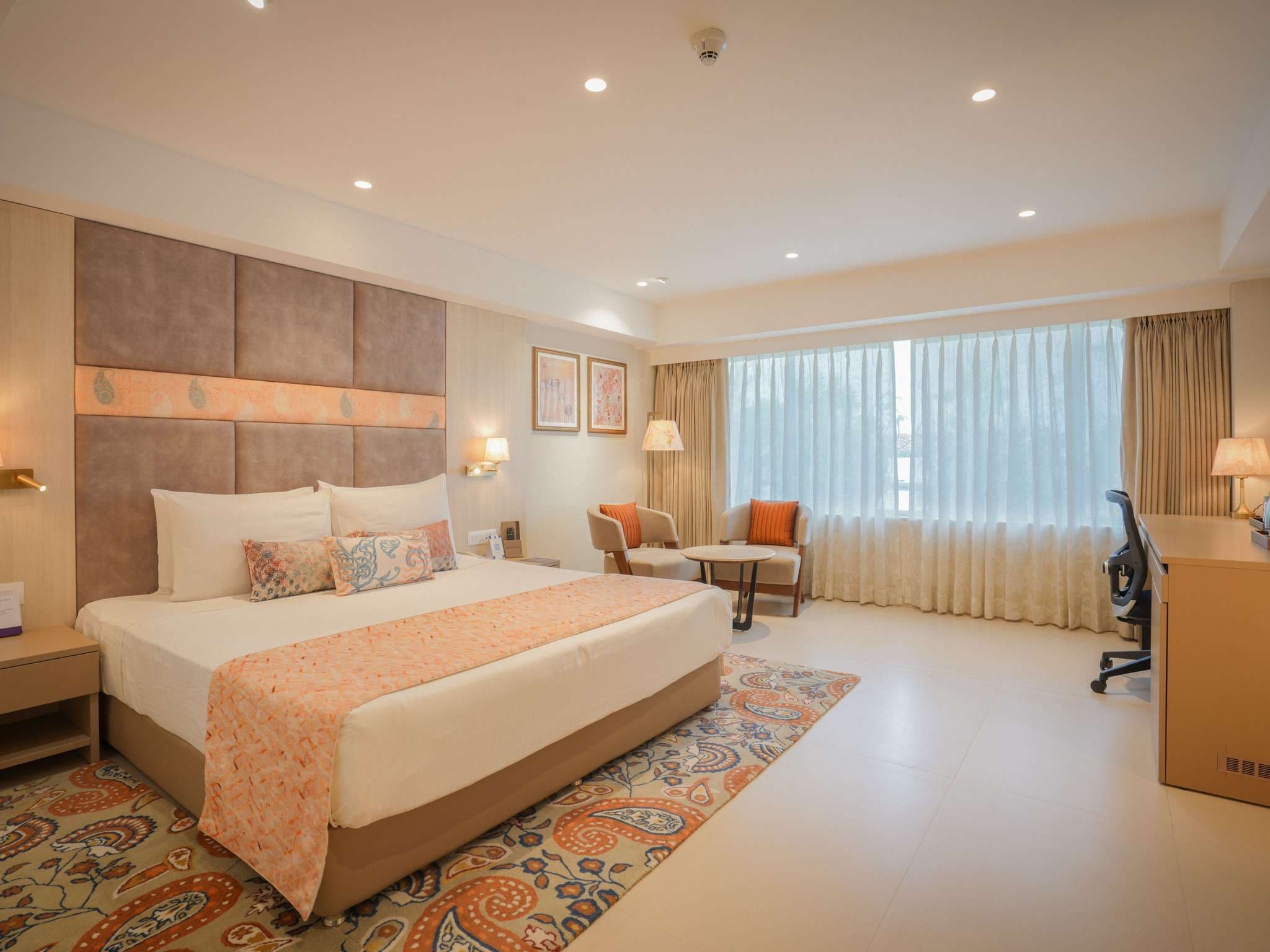 Executive Room with king bed and seating at Grand Mercure Vadodara Surya Palace
