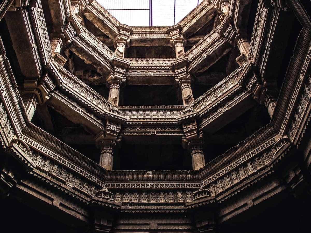 Looking up the carved octagonal shaft of Adalaj Stepwell near Ahmedabad, Gujarat
