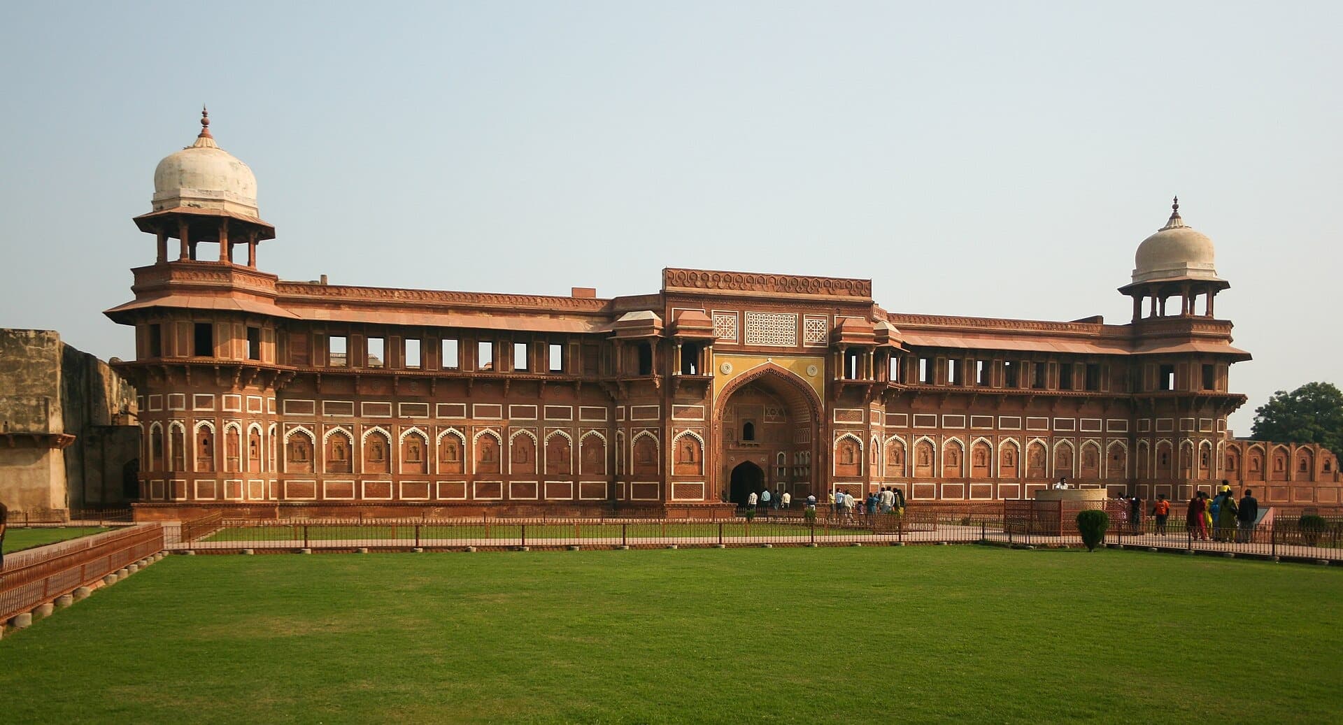 The red sandstone Jahangiri Mahal beside a lawn inside Agra Fort