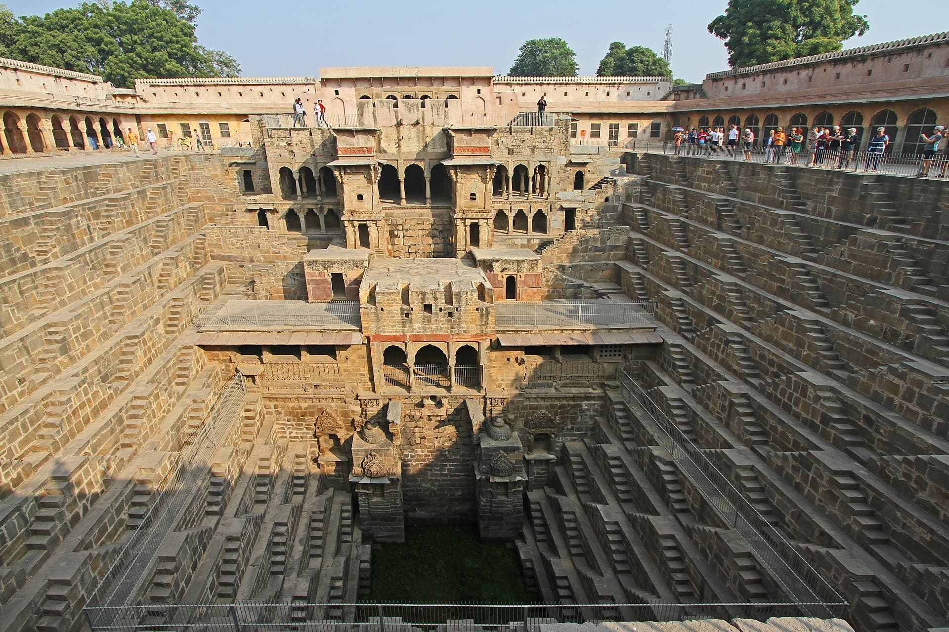 The square stepwell of Chand Baori at Abhaneri, with diagonal flights of steps on three sides and a pavilion on the fourth