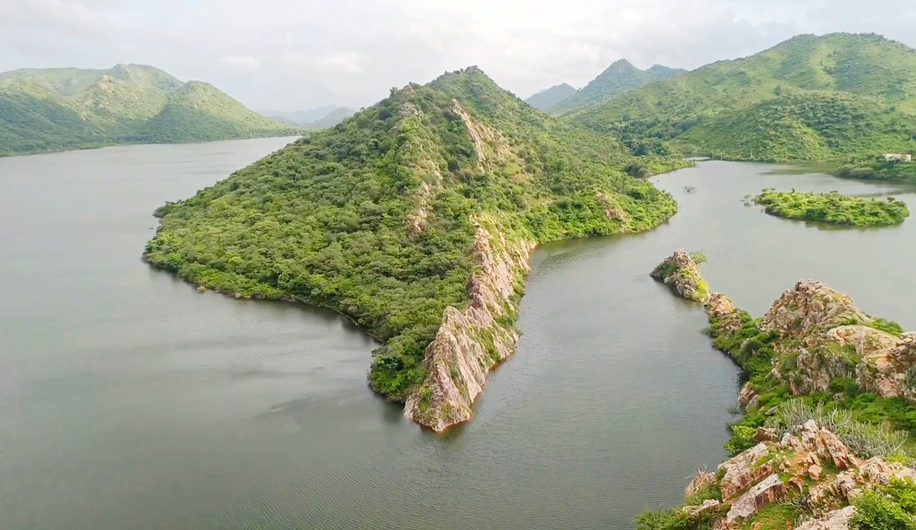 Green hills and a lake seen from Bahubali Hills, Udaipur