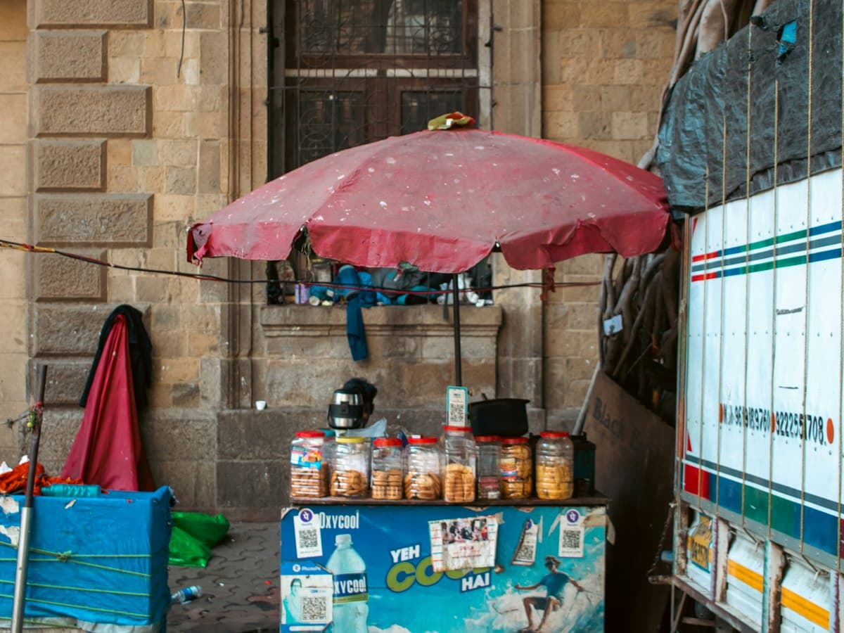 A tea stall with a teapot and biscuit jars at Ballard Estate in Fort, Mumbai