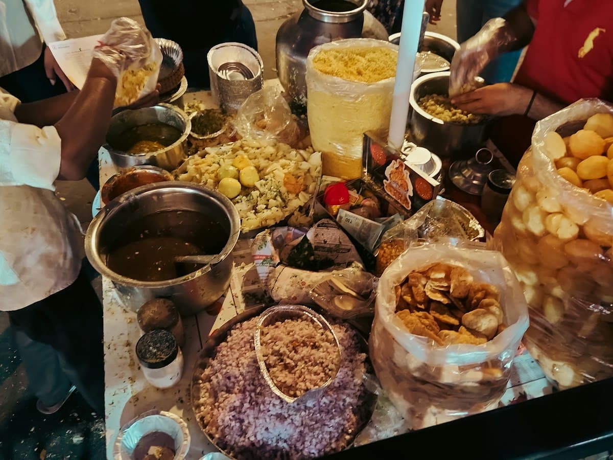 A chaat street food stall at night with ingredients laid out, Bandra, Mumbai