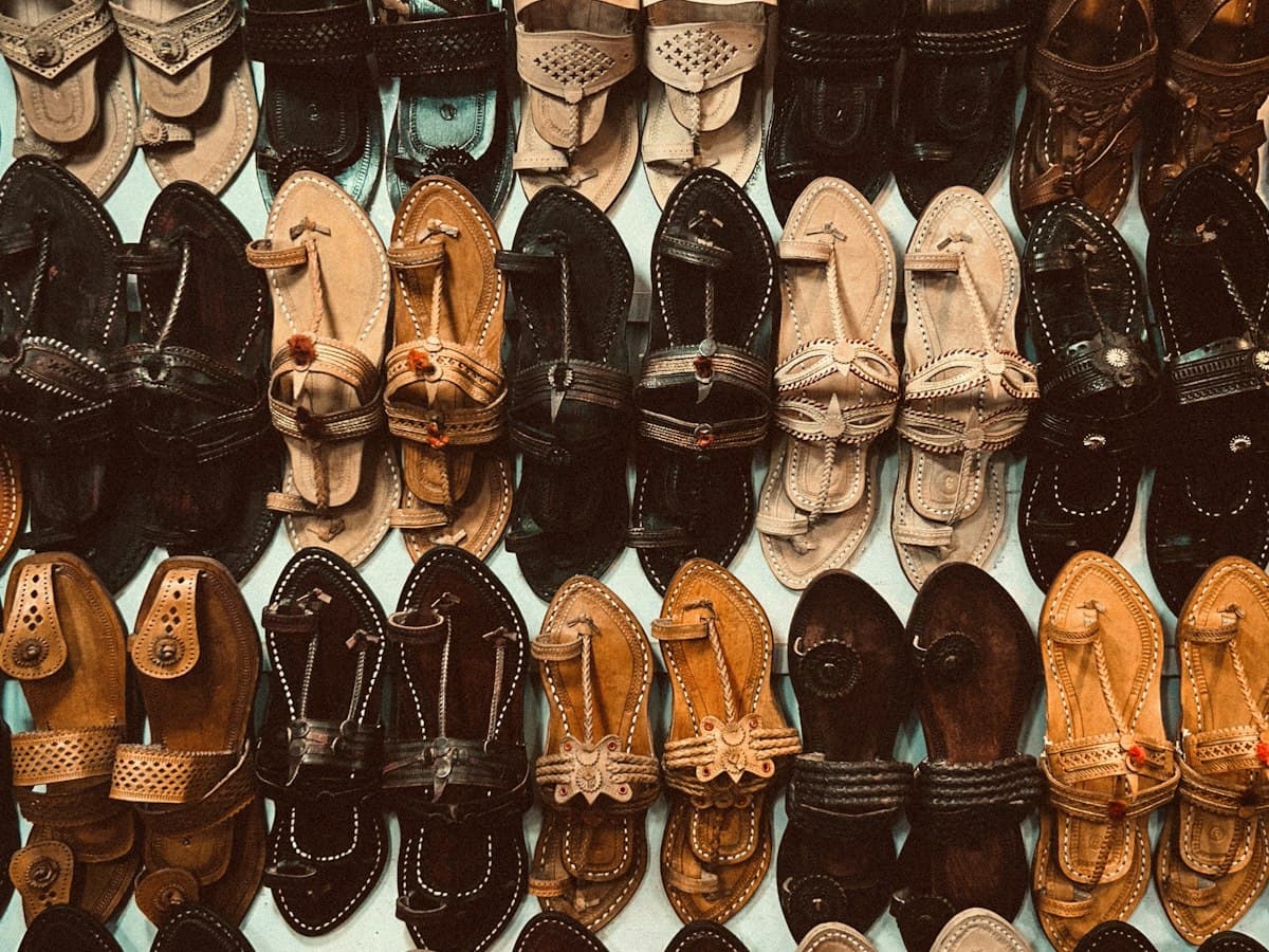 A display wall of leather sandals and chappals in a Kolhapur shop, Maharashtra