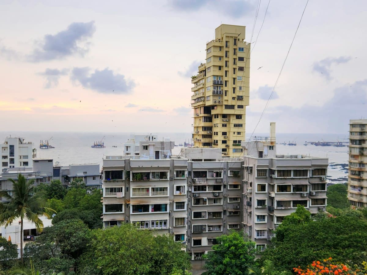 Bandra Bandstand skyline in Mumbai with towers, trees and the sea