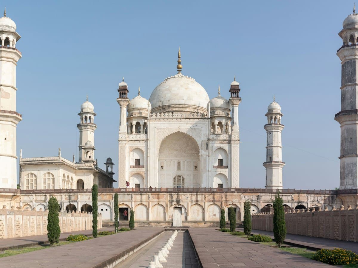 Bibi Ka Maqbara, the white marble Mughal mausoleum in Aurangabad, under a blue sky