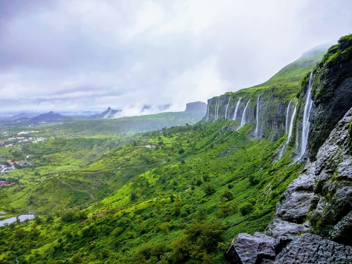 Monsoon waterfall tumbling down a rock face near Trimbak in the Nashik hills