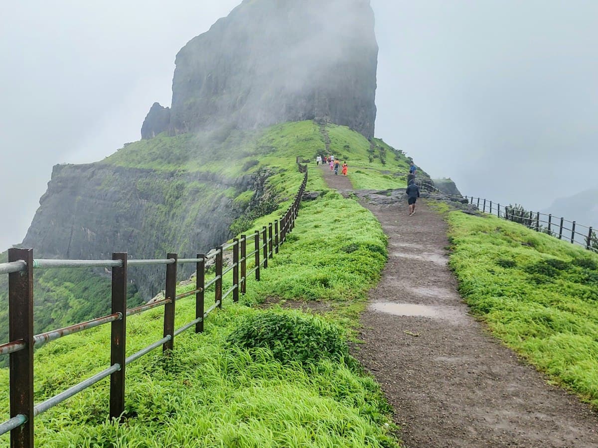Country path and green hills at Dhodap Fort in the Nashik district of Maharashtra