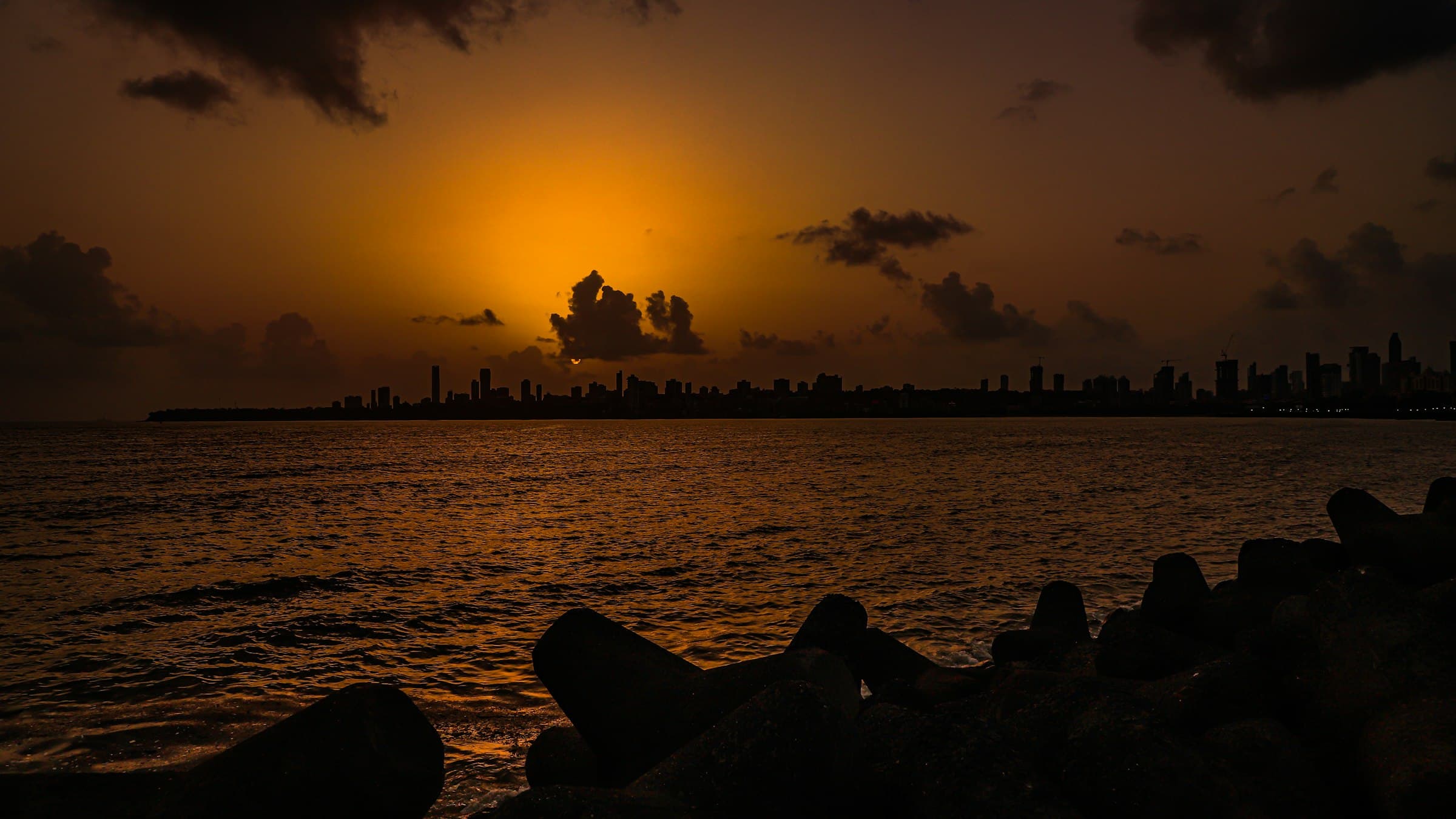 Sun setting over the Mumbai skyline from Marine Drive