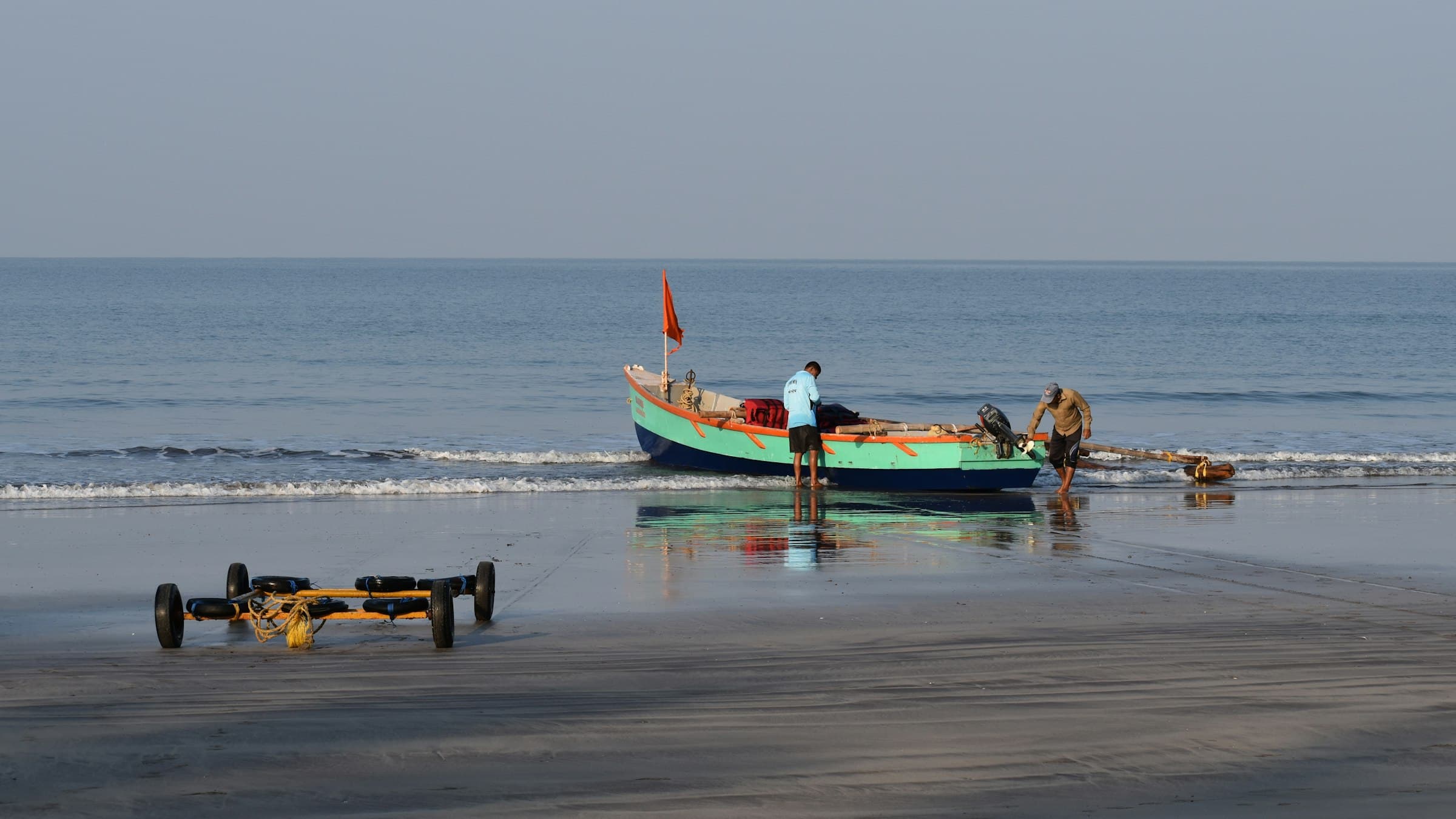 Wooden boat resting on a Konkan beach at Dapoli, Maharashtra, in early morning light