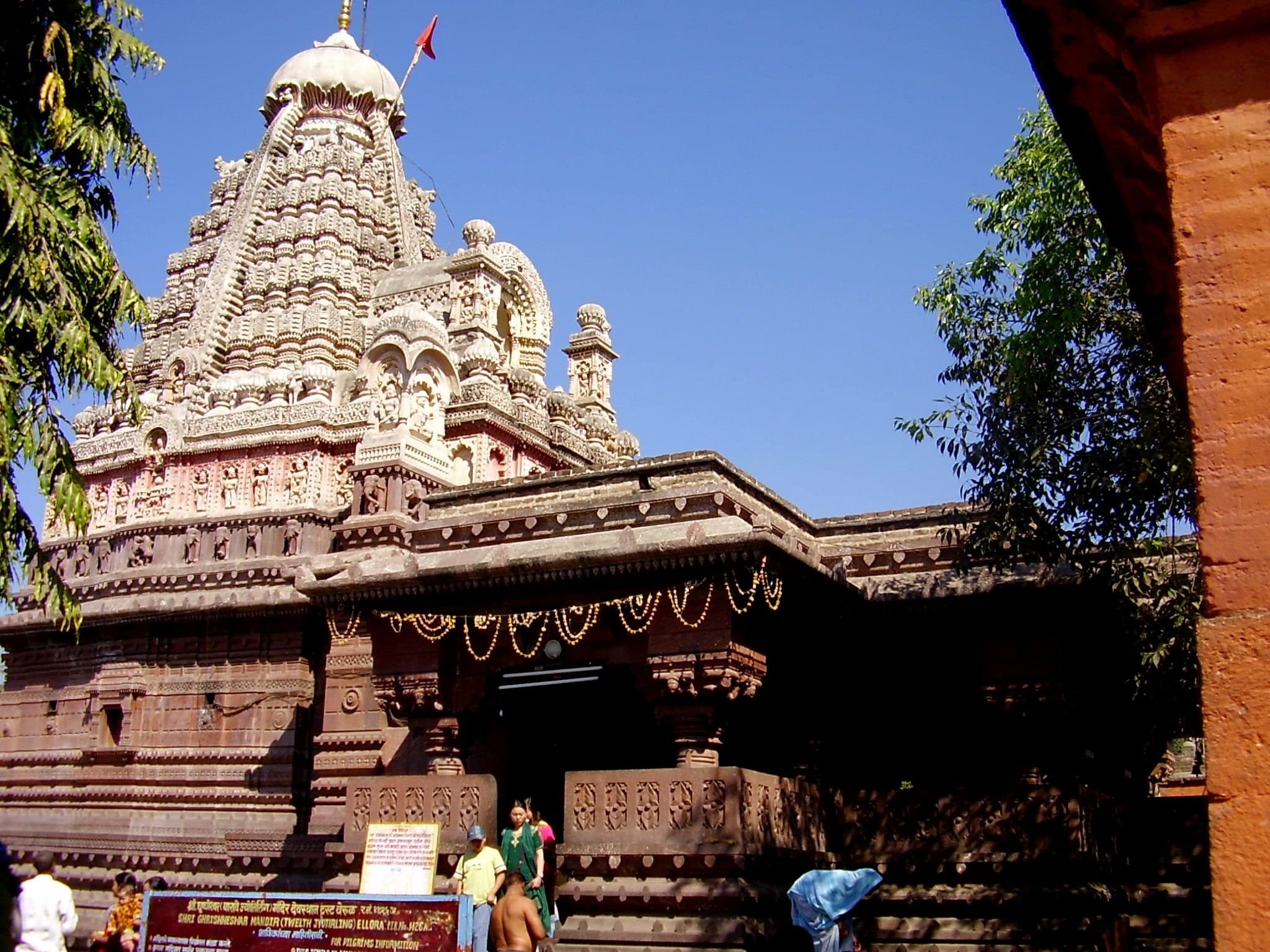 The carved red-stone shikhara and entrance mandapa of Grishneshwar Jyotirlinga Temple at Verul near Ellora, Maharashtra