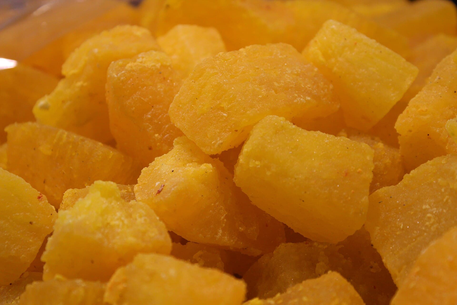 Cubes of orange kesari petha, the Agra sweet, in close-up