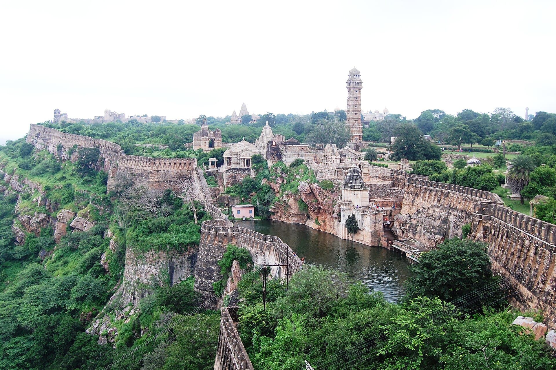 View across Chittorgarh Fort with its walls, a lake and the Vijay Stambh tower